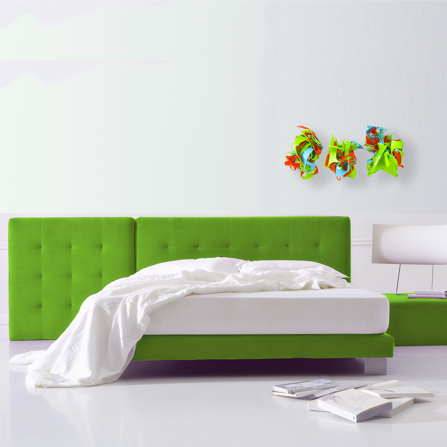 Colorful 3D wall art hanging over modern lime green bed in contemporary bedroom in a vertical row in Lime Green, Aqua Blue, and Orange - recycled acrylic abstract 3D wall art by AtomicMobiles.com