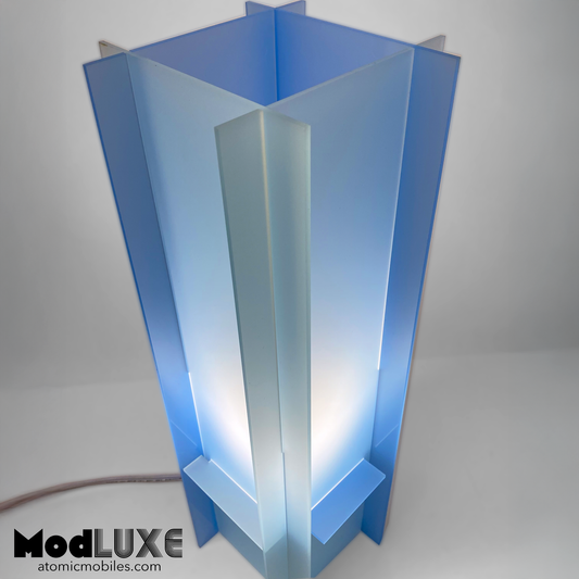 Closeup of stunningly beautiful baby blue table lamp in space age modern style with reversible color by AtomicMobiles.com