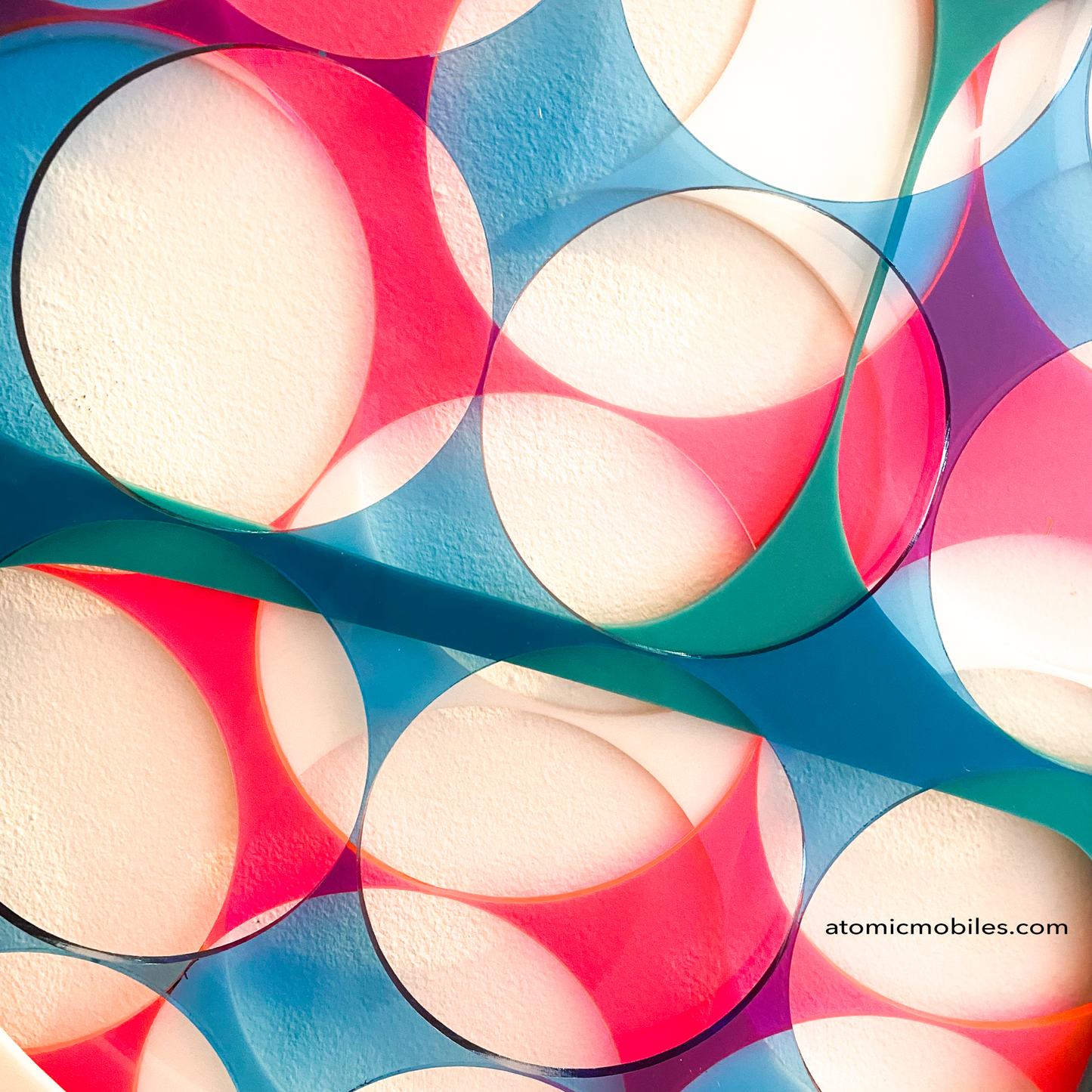 Close up of 3D Abstract Wall Art Panel in fluorescent pink, clear blue, and aqua by AtomicMobiles.com