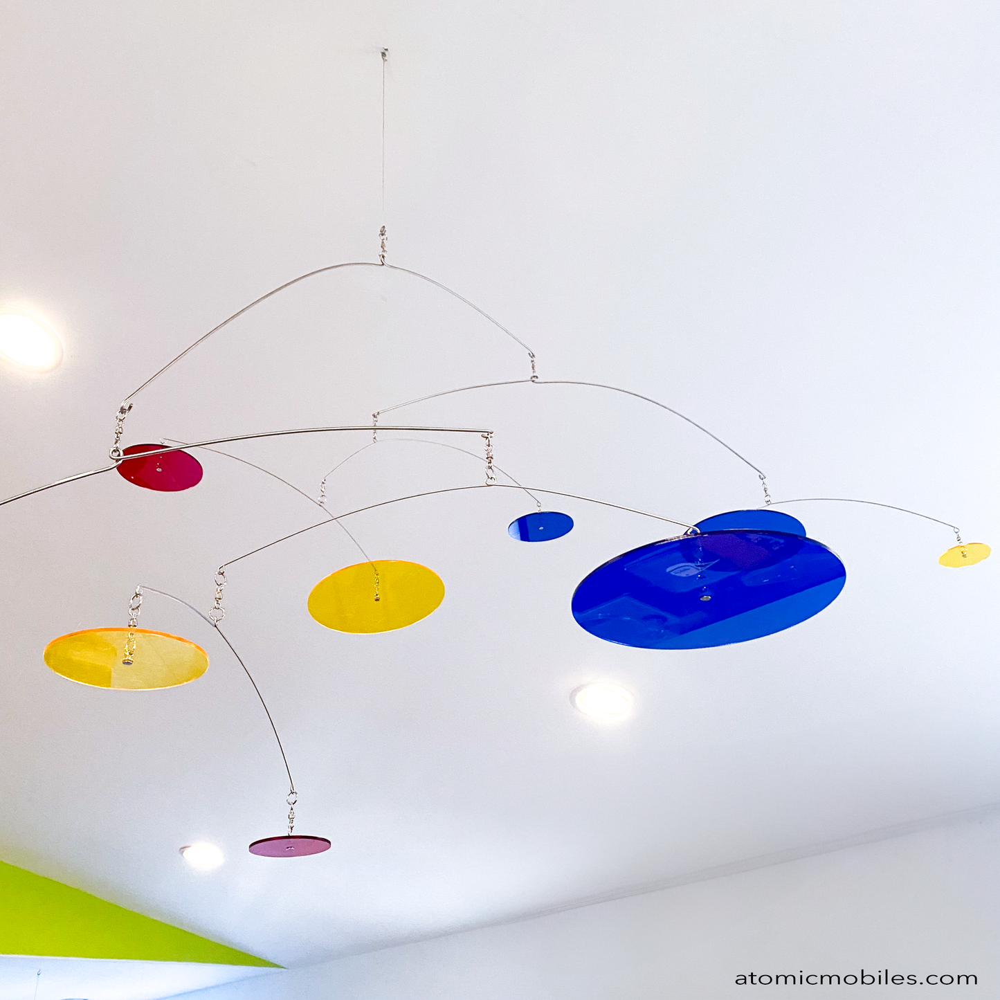 Closeup of Ascend 8 foot hanging art mobile with horizontal acrylic circles by AtomicMobiles.com