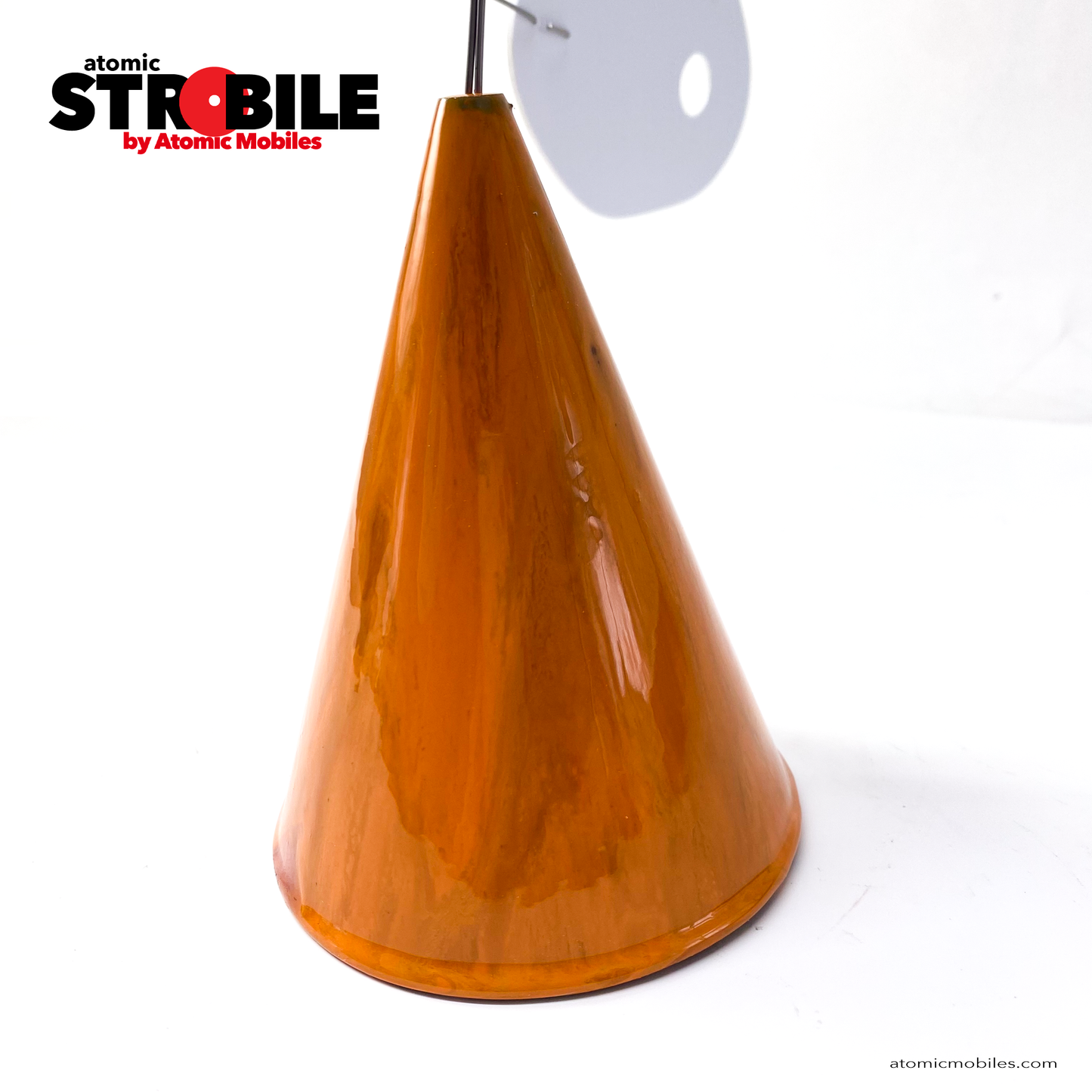 Closeup of The Strobile kinetic tabletop art stabile mobile sculpture by AtomicMobiles.com featuring one of a kind marbled burnt orange cone base