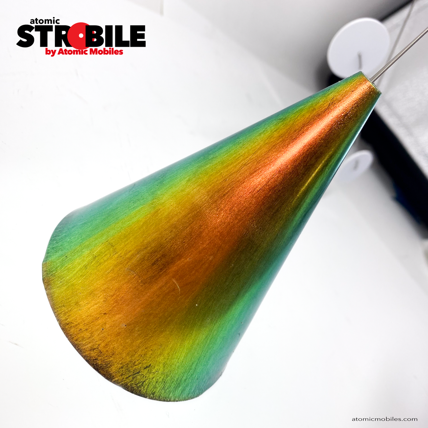 Side view of gorgeous PRISM metallic-look base art sculpture - The Strobile Modern Art Tabletop Kinetic Mobile - with white mobile shapes and color changing cone base by AtomicMobiles.com