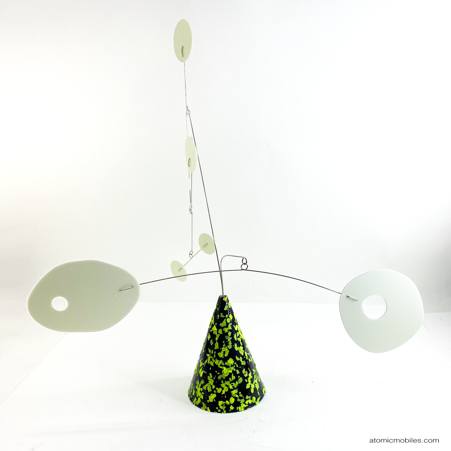 Beautiful art sculpture with lime green and black cone that glows under black light, with glow in the dark shapes by AtomicMobiles.com