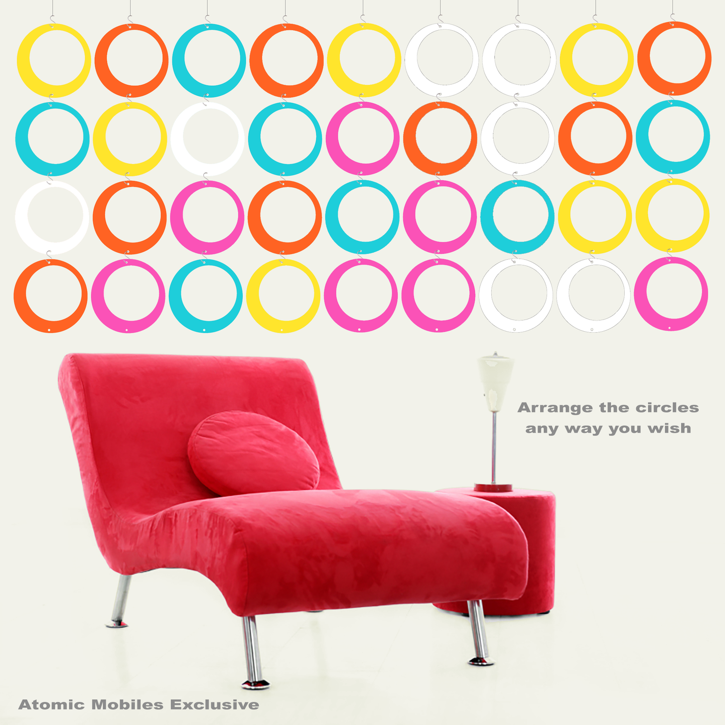 Groovy HIPSTER CIRCLES DIY KIT shown with pink modern chair -- 36 parts of Aqua, White, Yellow, Orange, and Hot Pink to make art mobiles, curtains, room dividers and more by AtomicMobiles.com