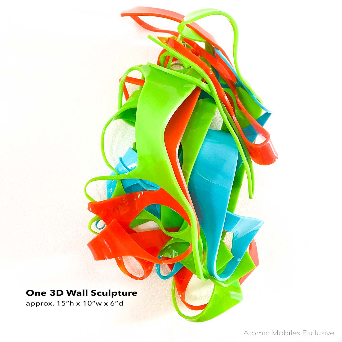 One Colorful 3D wall art hanging in Palm Springs colors of Lime Green, Aqua Blue, and Orange - recycled acrylic abstract 3D wall art by AtomicMobiles.com