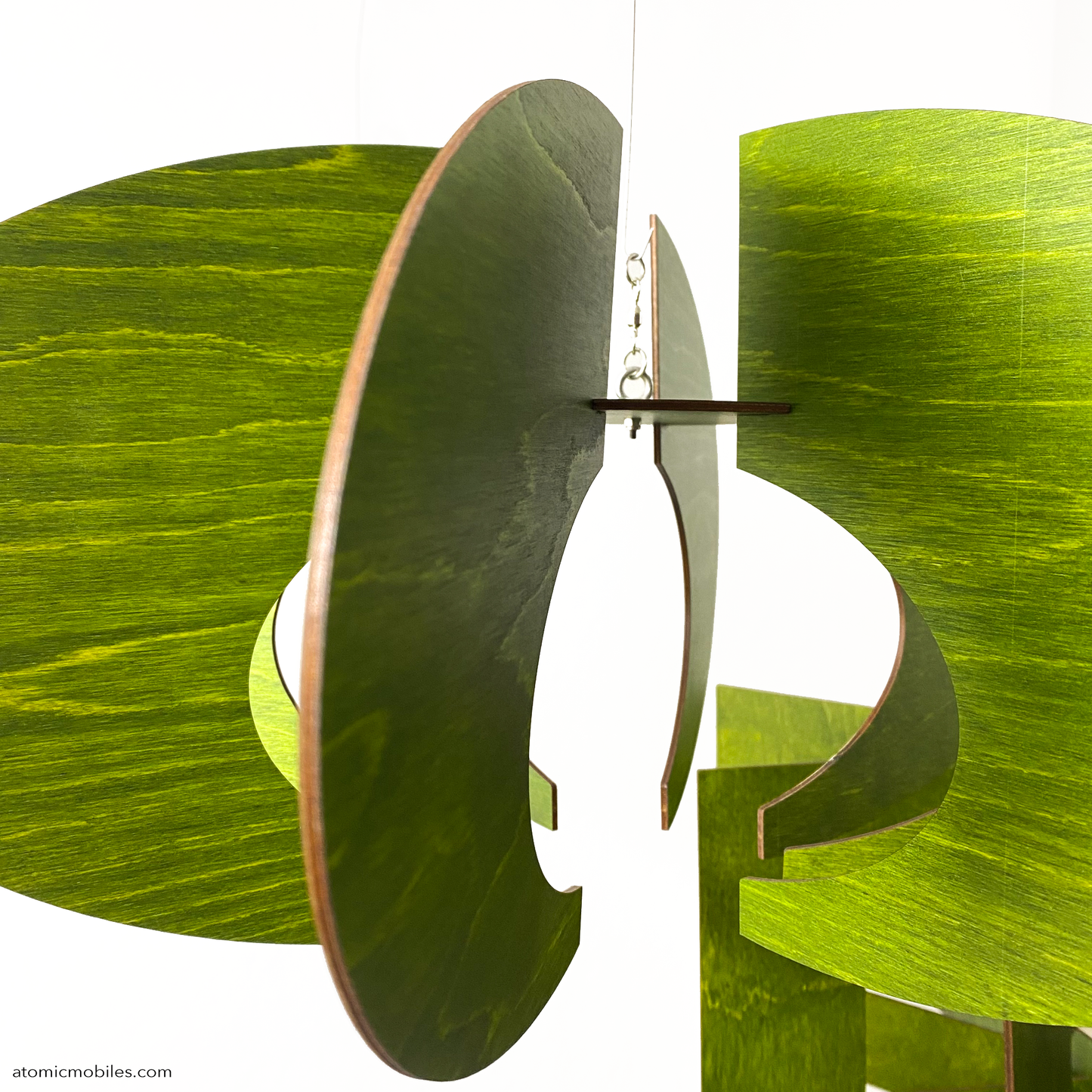 Closeup of Orbit ROTAMOBILE in lovely Kiwi Green stained wood - kinetic hanging art mobile sculptures by AtomicMobiles.com