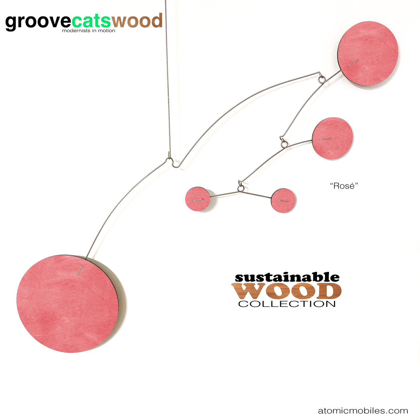 The Moderne hanging art mobile in sustainable wood - shown here in Rose pink stained wood - designed and made to order in Los Angeles by AtomicMobiles.com