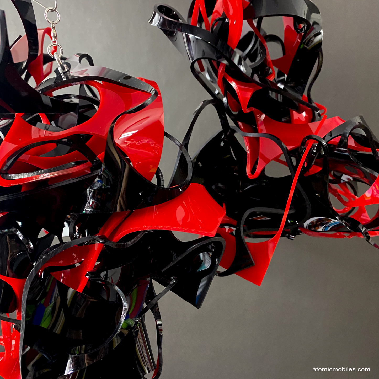 Another closeup of dramatic trio of 3 black and red abstract art mobiles made from plexiglass acrylic - unique one of a kind kinetic art by AtomicMobiles.com