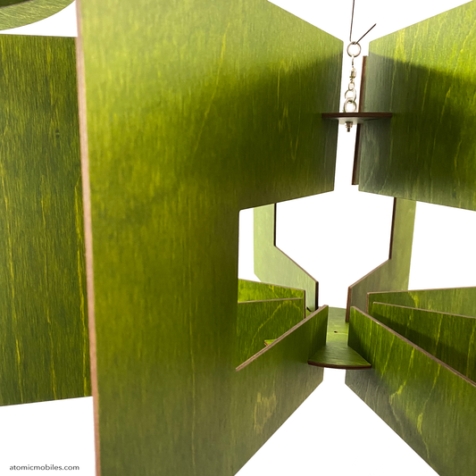 Closeup of SPACE AGE hanging art ROTAMOBILE by AtomicMobiles.com in Kiwi Green stained wood