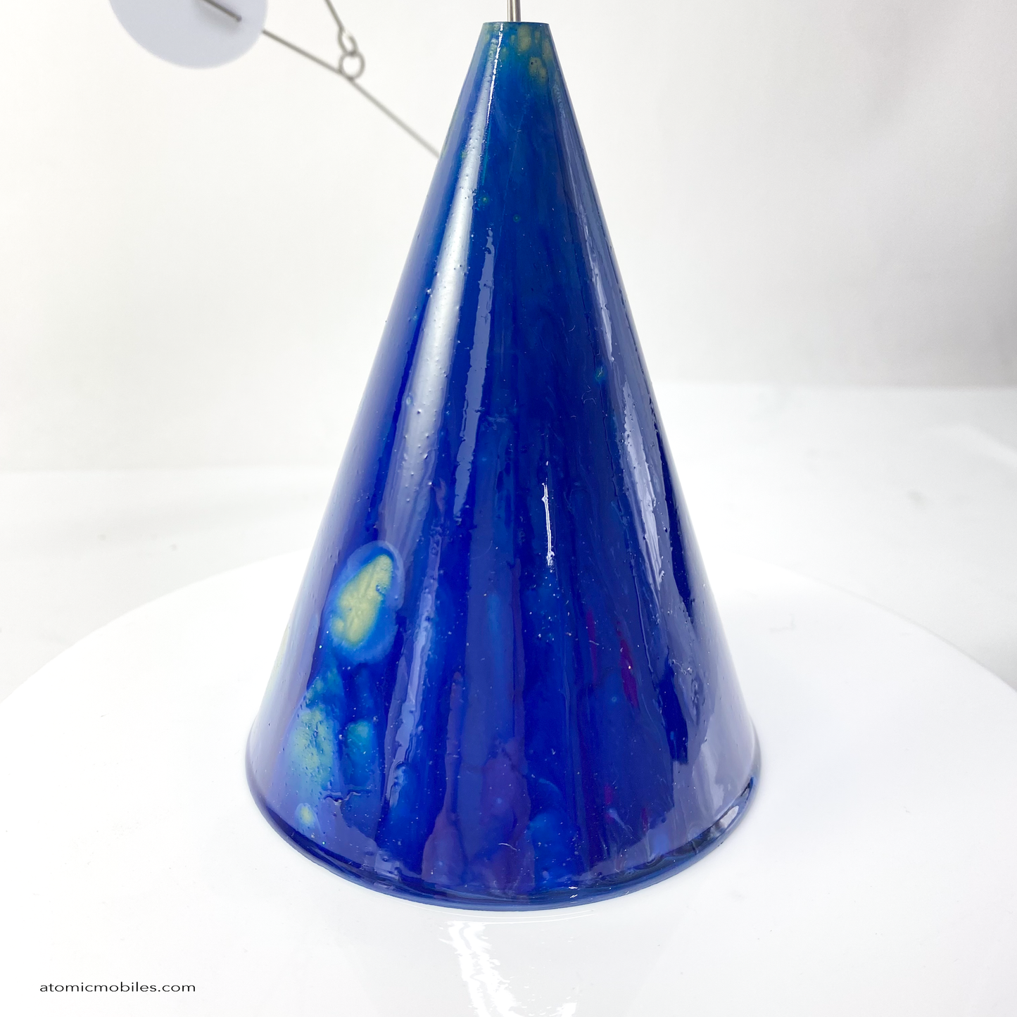 Another side of The Strobile Kinetic Art Sculpture with Van Gogh inspired Starry Night blue cone base and white shapes by AtomicMobiles.com
