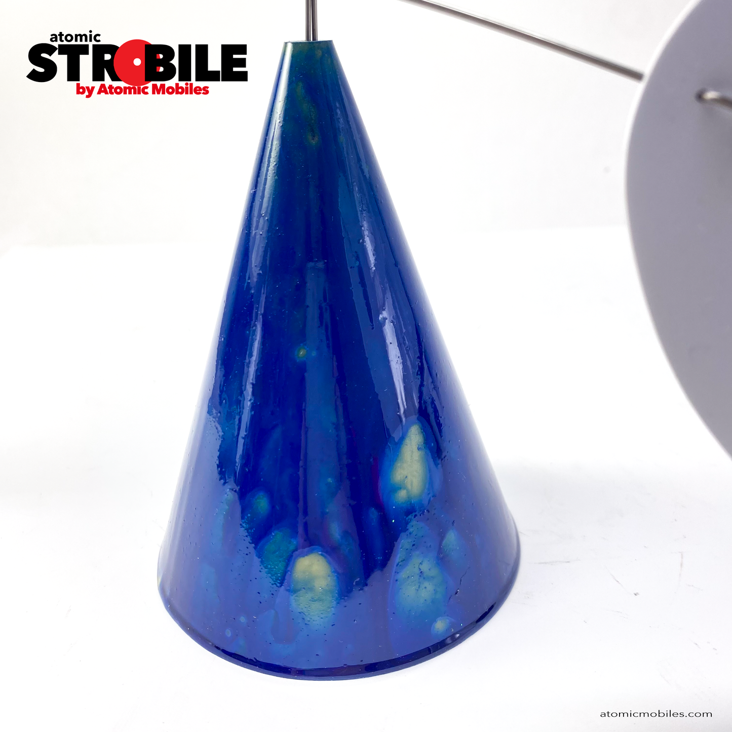 Closeup of the cone of The Strobile Kinetic Art Sculpture with Van Gogh inspired Starry Night blue cone base and white shapes by AtomicMobiles.com