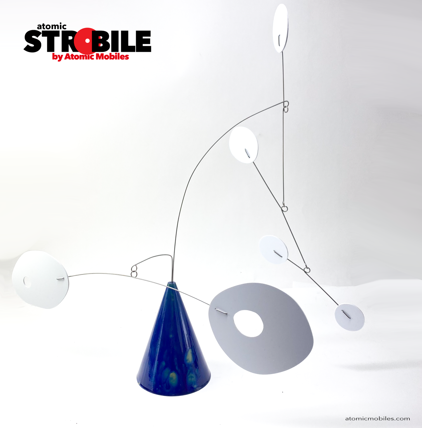 The Strobile Kinetic Art Sculpture with Van Gogh inspired Starry Night blue cone base and white shapes by AtomicMobiles.com