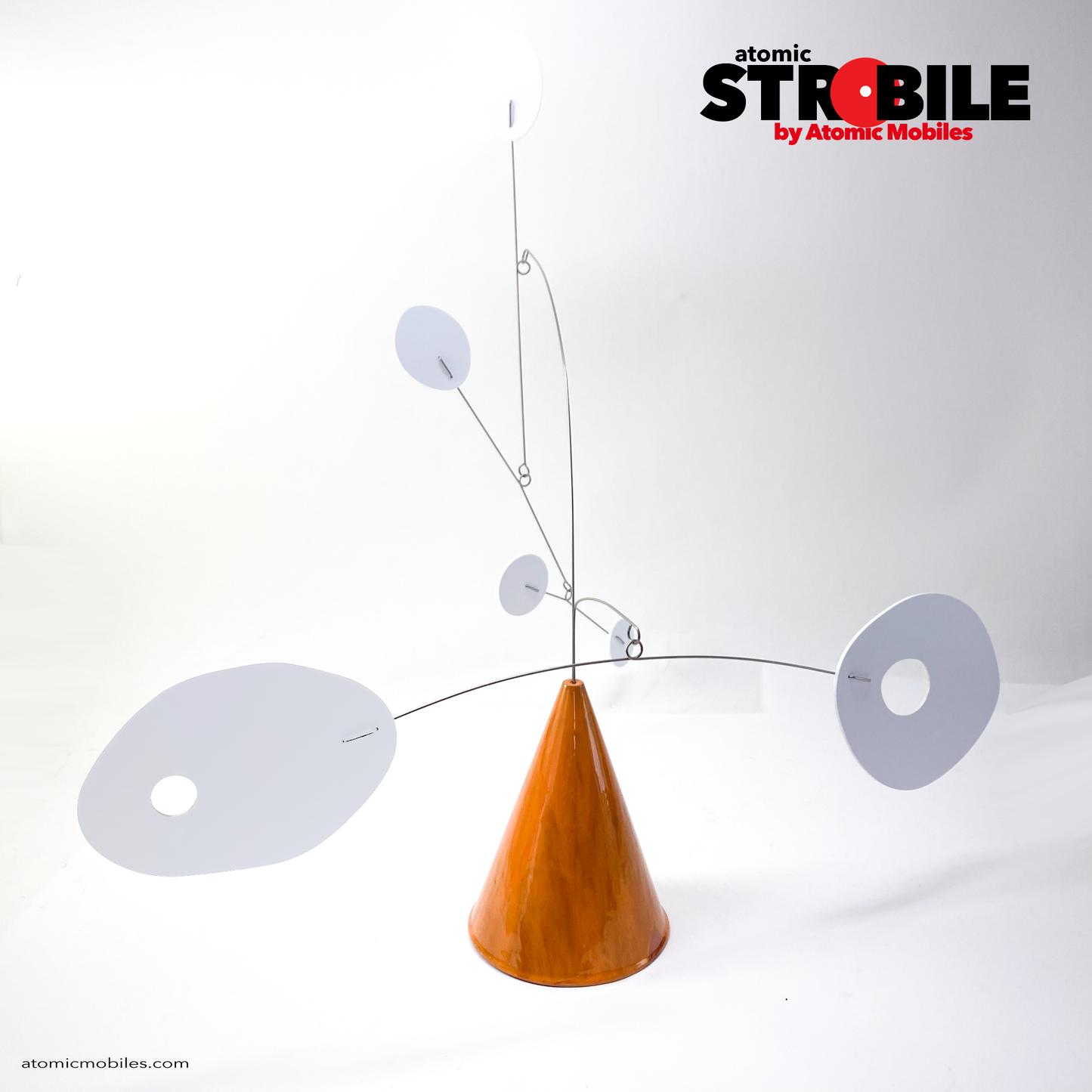 The Strobile kinetic tabletop art stabile mobile sculpture by AtomicMobiles.com featuring one of a kind marbled burnt orange cone base