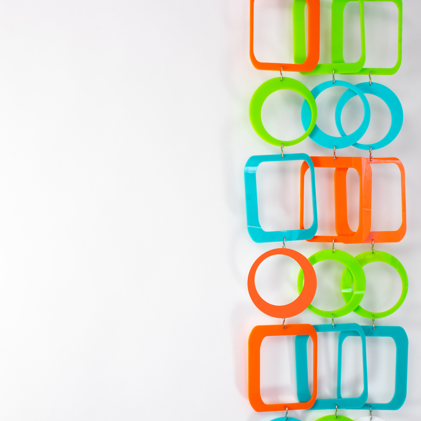 Close up of Palm Springs DIY Mobile Kit in Orange, Aqua Blue, and Lime Green to make mobiles, curtains, room dividers and more - by AtomicMobiles.com