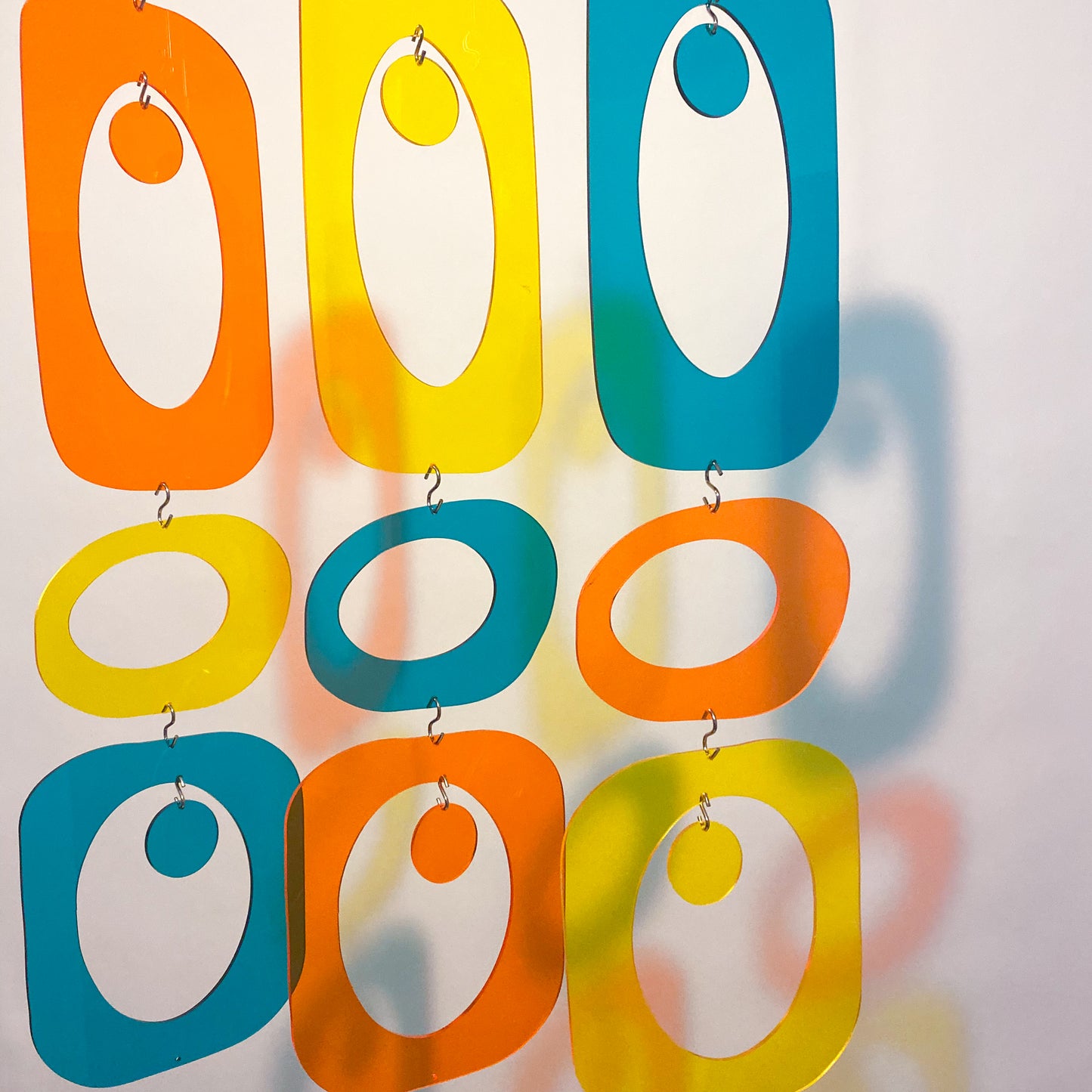 Clear Beatnik Party Retro Room Divider DIY Kit Parts in Clear Orange Acrylic, Clear Yellow Arylic, and Clear Teal Acrylic by AtomicMobiles.com