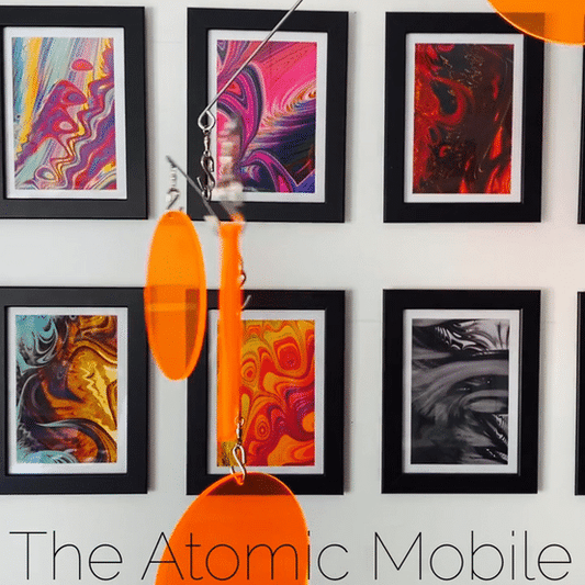 Animated gif of The Atomic Mobile in Clear Orange Acrylic - hanging art mobiles by AtomicMobiles.com