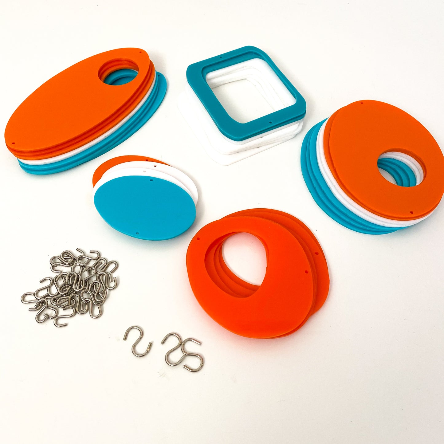 Parts for cool retro kinetic art piece in orange, white, and aqua for wall art, mobiles, or room dividers by AtomicMobiles.com