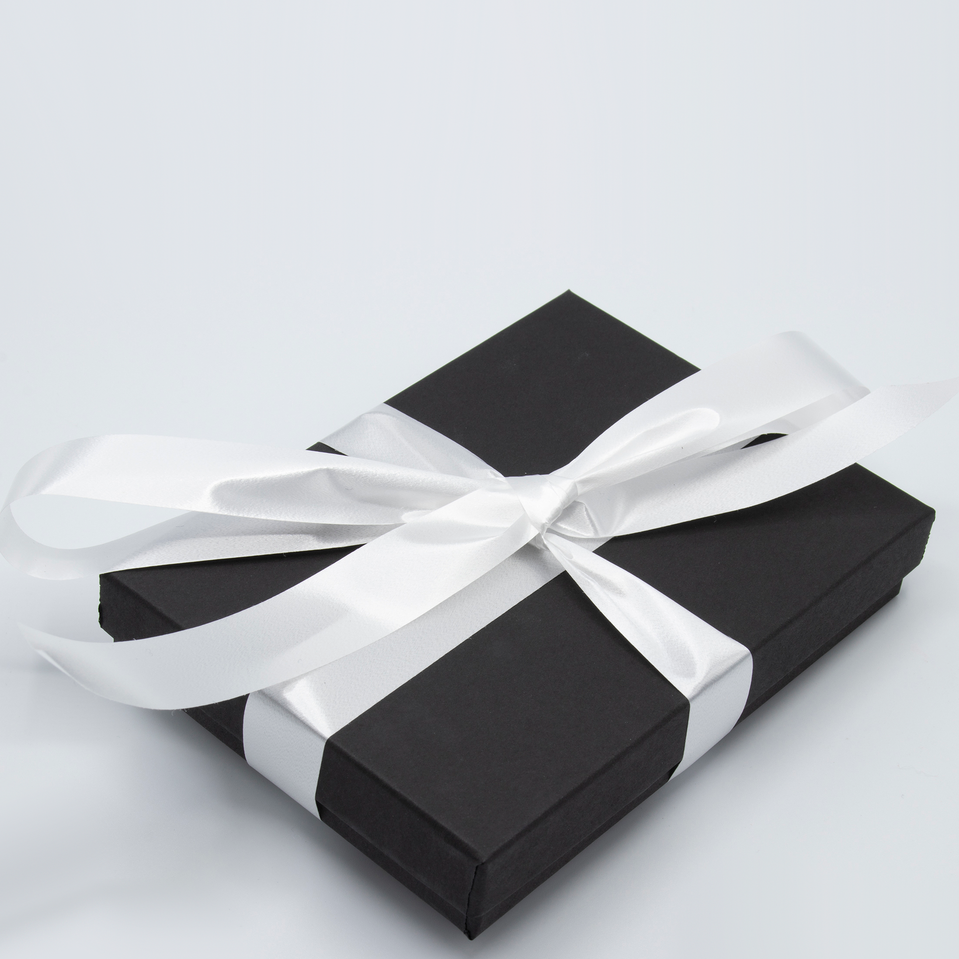 Black Gift Box with White Ribbon is included with Atomic Earrings by AtomicMobiles.com