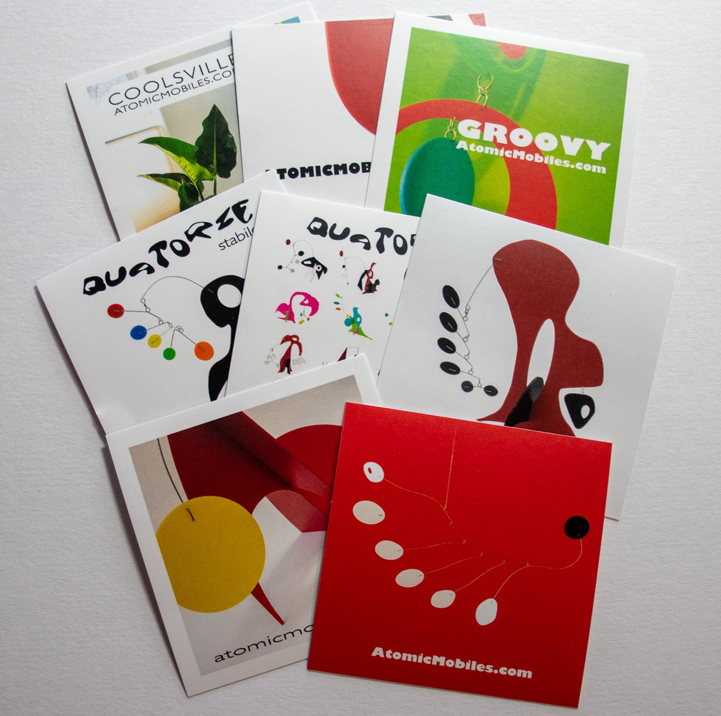 Set of 8 colorful fun stickers featuring AtomicMobiles.com mobiles and stabiles, designed by owner Debra Ann
