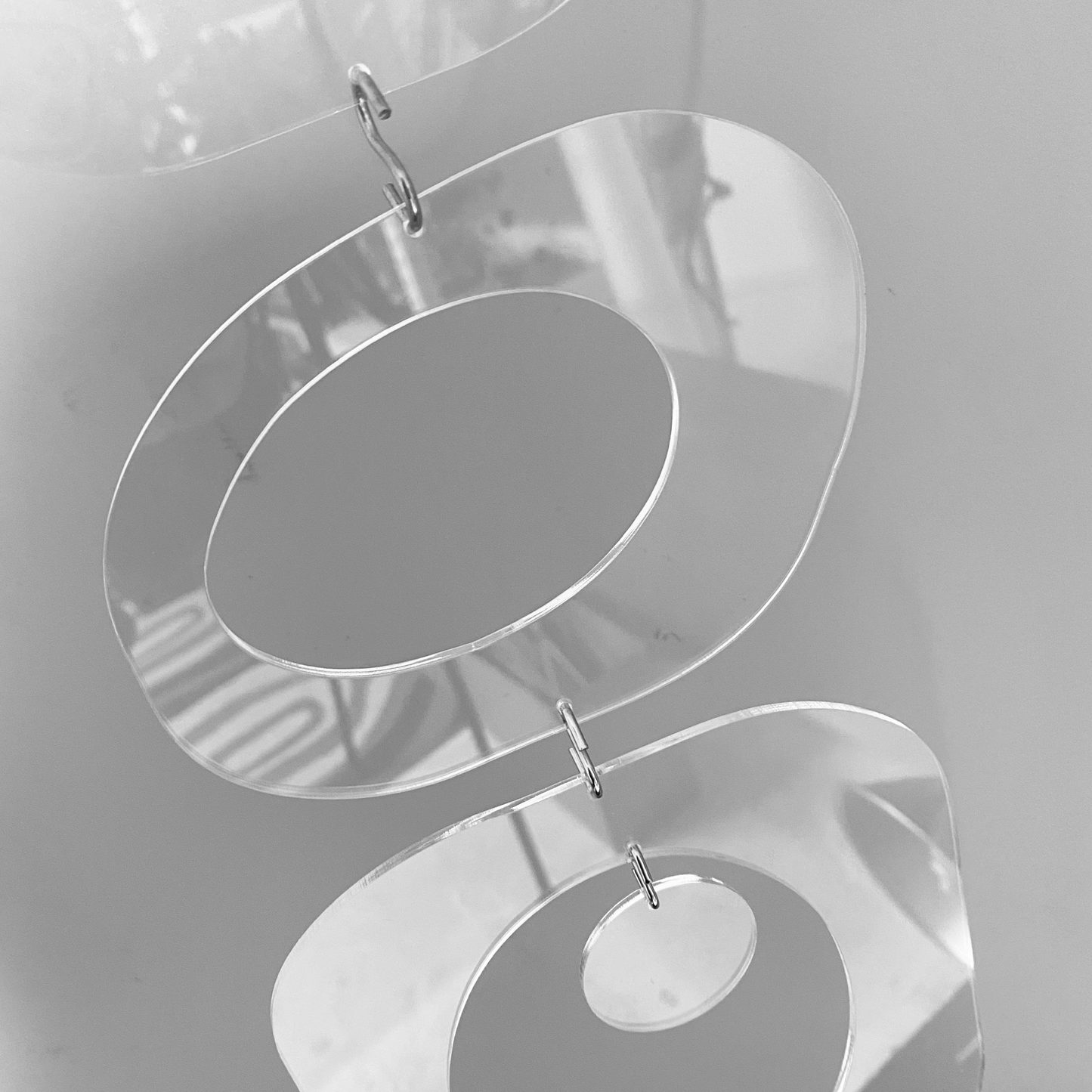 Closeup of Beatnik Party DIY KIT for mobiles, room dividers, and curtains in Clear Lucite Acrylic by AtomicMobiles.com