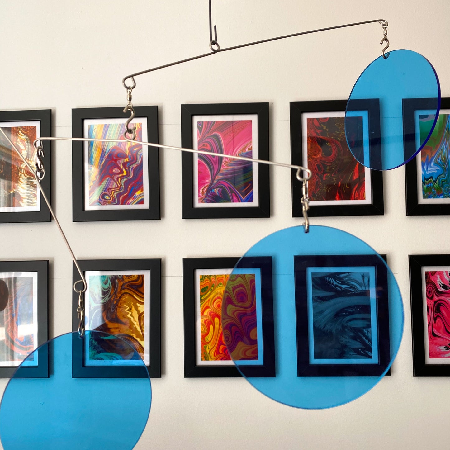 Clear Blue Atomic Mobiles in front of MiniMOD abstract colorful art prints by AtomicMobiles.com