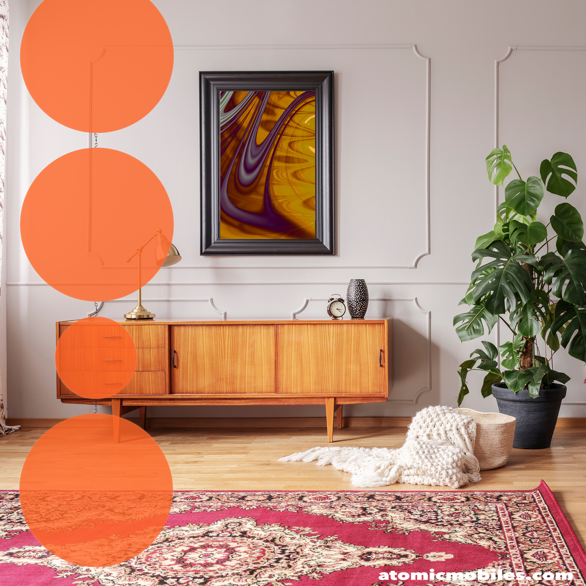 Transparent Orange BOLD AF vertical hanging art mobile by AtomicMobiles.com with 4 large circles that swivel 360 degrees, in modern beige room with wood credenza, abstract framed art, oriental rug, and plant.