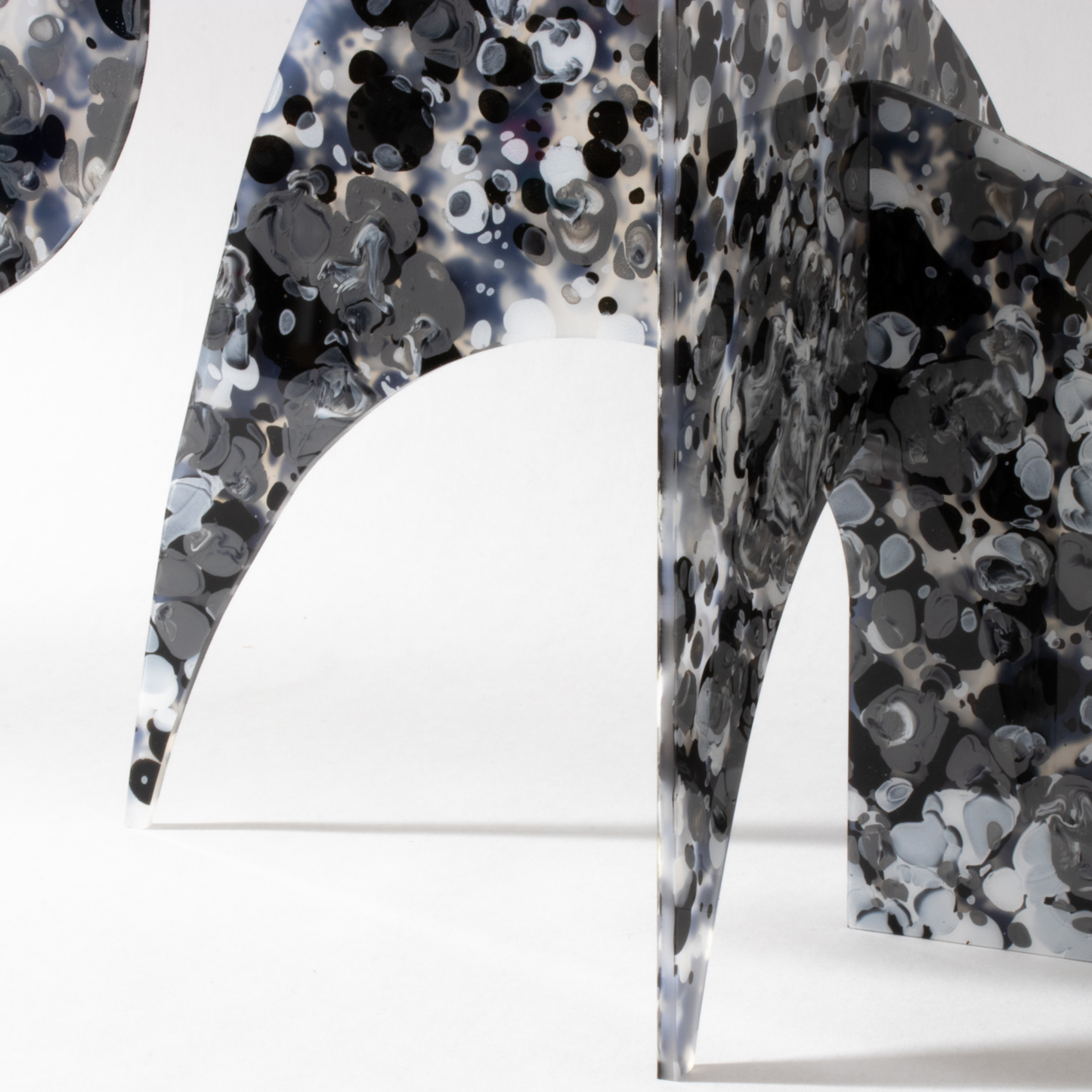 Closeup of exotic acrylic base of The Moderne Modern Art Stabile Sculpture in intriguing black, white, and gray abstract colors - handmade modern tabletop mobile by AtomicMobiles.com