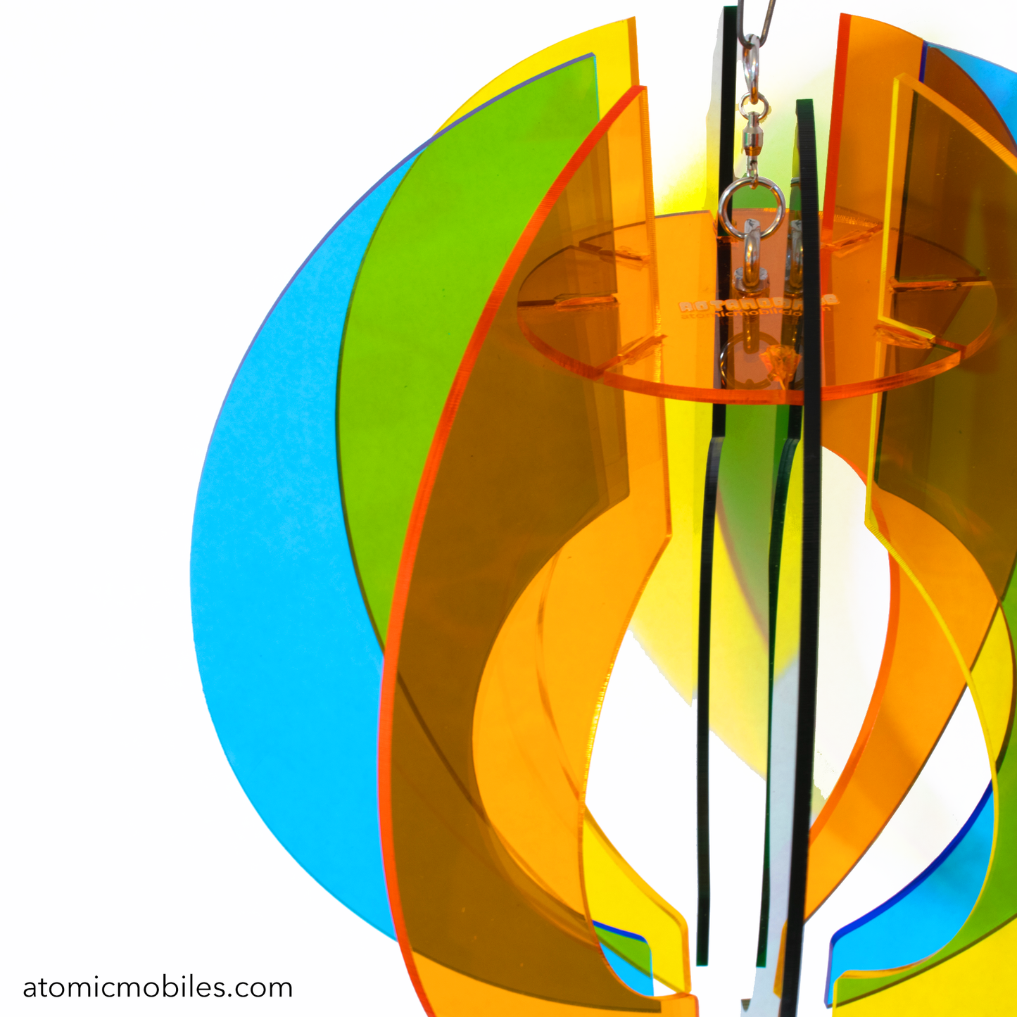 Closeup of beautiful Sphere Space Age RotaMobile by AtomicMobiles.com in Orange, Yellow, Green, and Blue clear acrylic