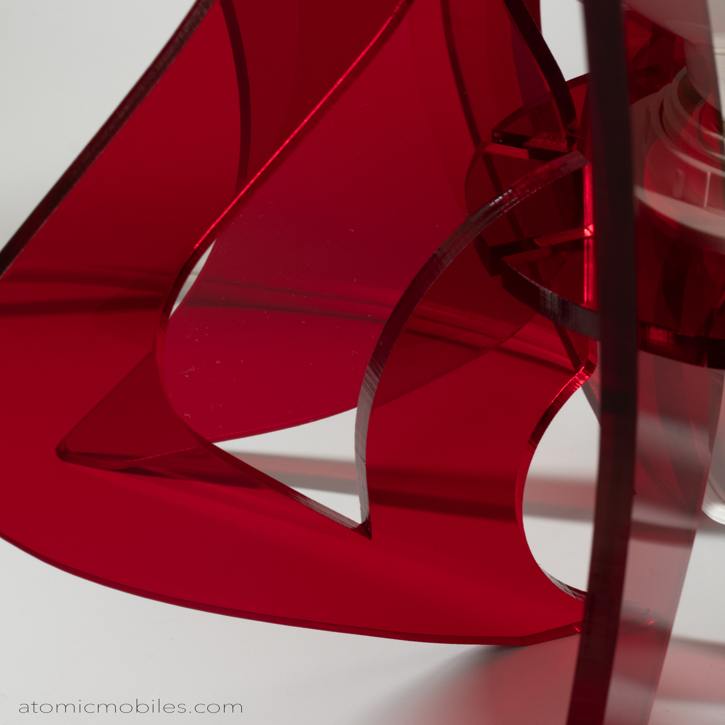 Closeup of spectacular retro mid century modern style acrylic plexiglass table top lamp in clear red by AtomicMobiles.com