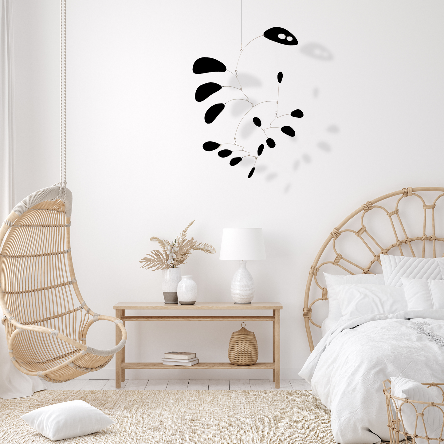 Black CoolCat kinetic mid century modern style hanging art mobile in boho bedroom with hanging chair, end table and wicker bed - bespoke art mobiles by AtomicMobiles.com