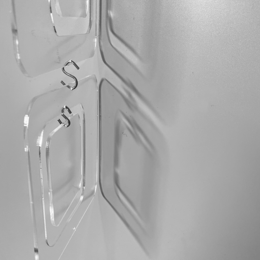 Closeup of Coolsville DIY KIT for mobiles, room dividers, and curtains in Clear Lucite Acrylic by AtomicMobiles.com