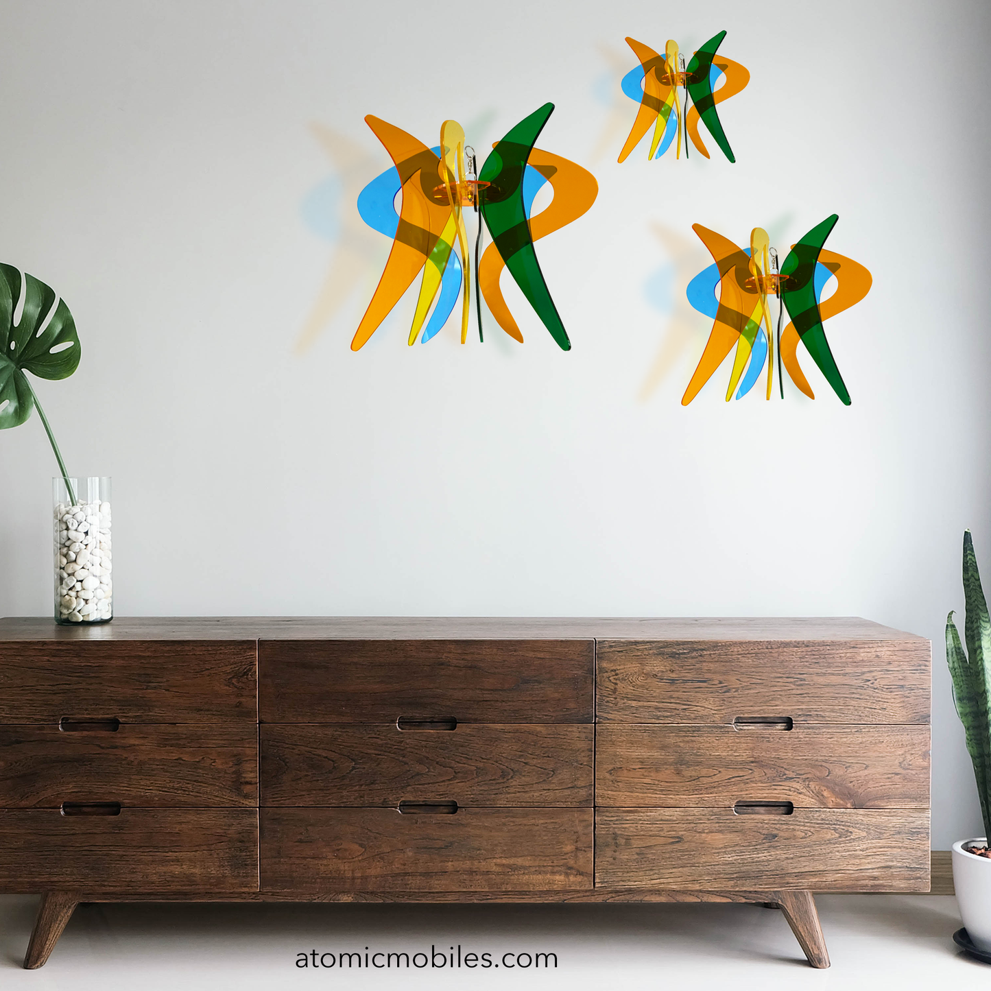 Beautiful grouping of 3 GENIE RotaMobiles in clear acrylic plexiglass colors of Orange, Blue, Green, and Yellow - kinetic hanging art mobiles by AtomicMobiles.com