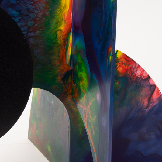 Closeup of dark red, blue, yellow, green modern kinetic art sculpture stabile - one of a kind hand painted stabiles by AtomicMobiles.com