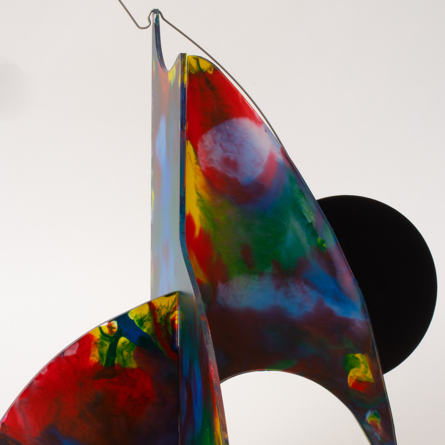 Side view of dark red, blue, yellow, green modern kinetic art sculpture stabile - one of a kind hand painted stabiles by AtomicMobiles.com