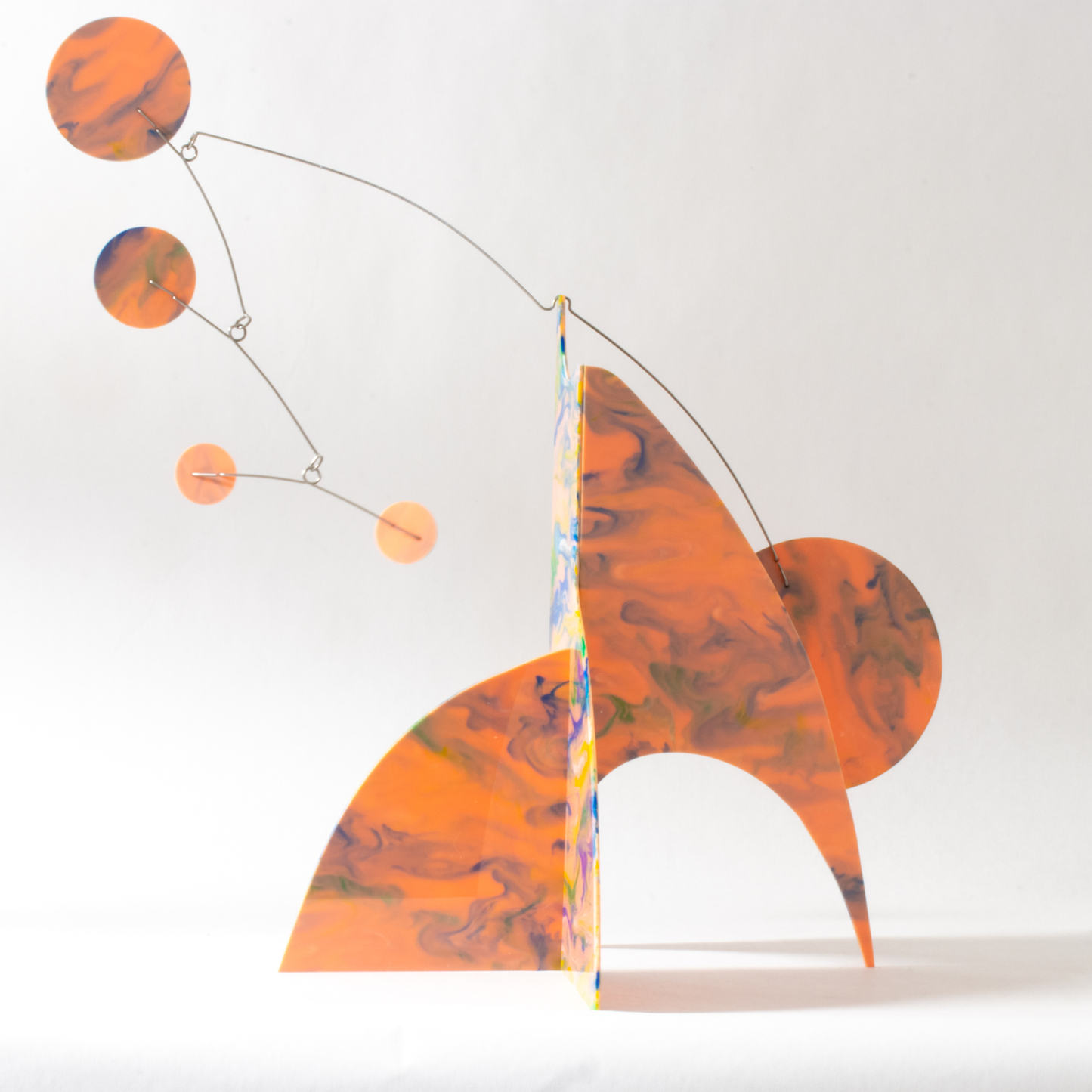 SIde view of Peachy Moderne Art Stabile with beautiful swirls of green, orange, pink and green colors by AtomicMobiles.com