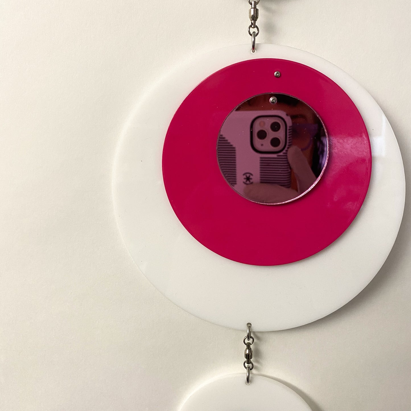 Reflection of photographer in Groovy DOTS in white, hot pink, and pink mirror by AtomicMobiles.com