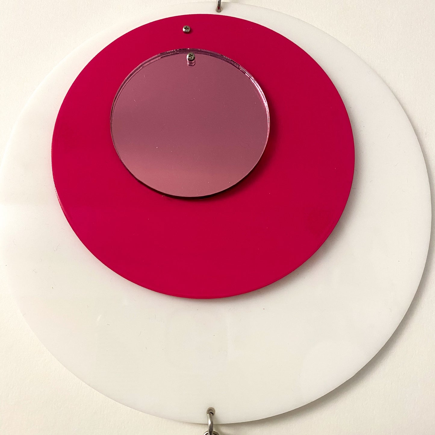 Closeup of Groovy DOTS in white, hot pink, and pink mirror by AtomicMobiles.com
