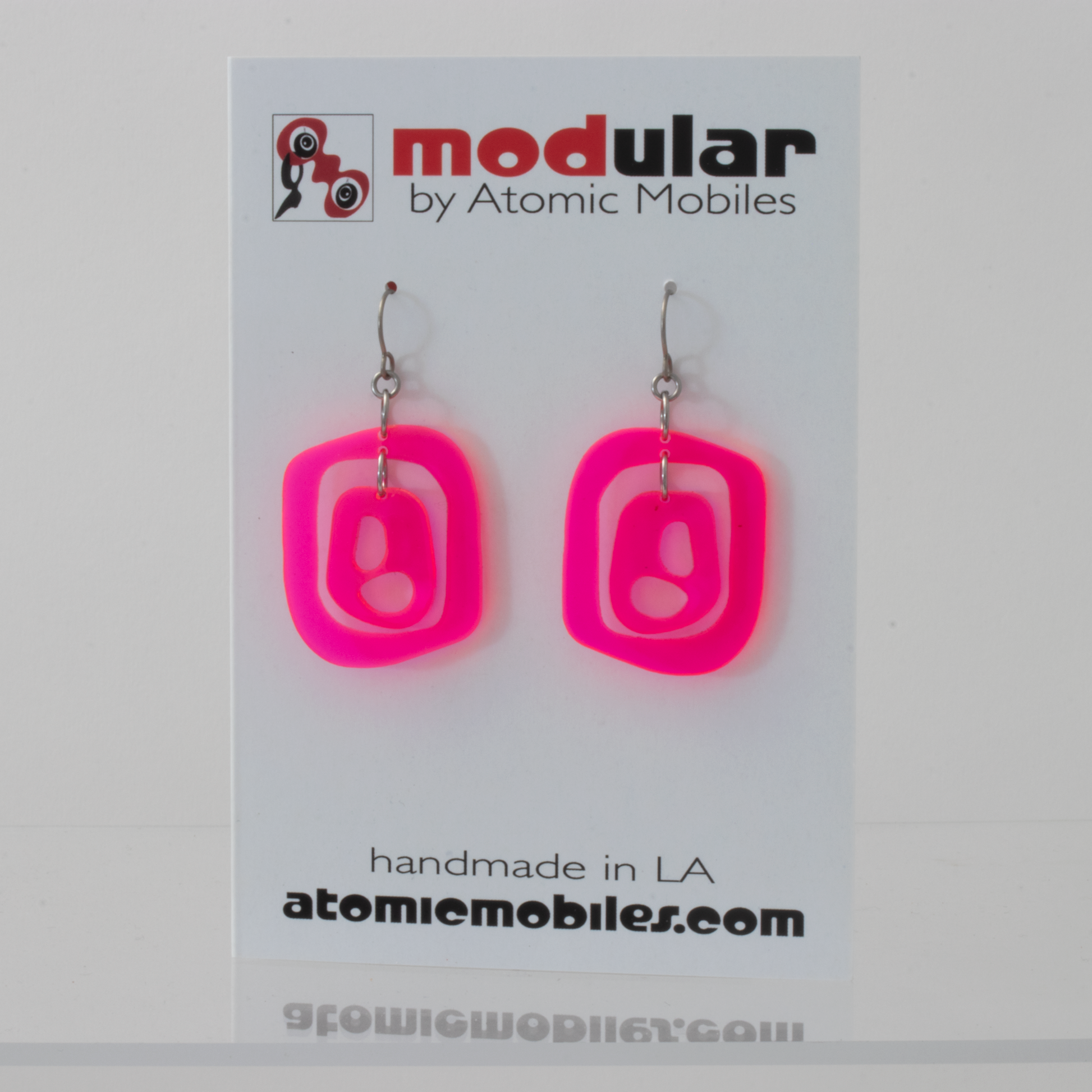 Mid 20th 1960s Mid Century Modern Style Earrings in Neon Fluorescent Hot Pink plexiglass acrylic by AtomicMobiles.com