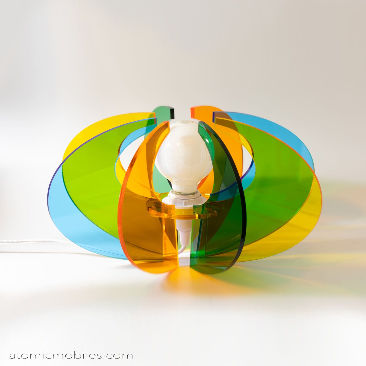ASTRO LUMA ORBIT retro mid century modern style lamp in clear orange, green, yellow, and blue acrylic plexiglass by AtomicMobiles.com