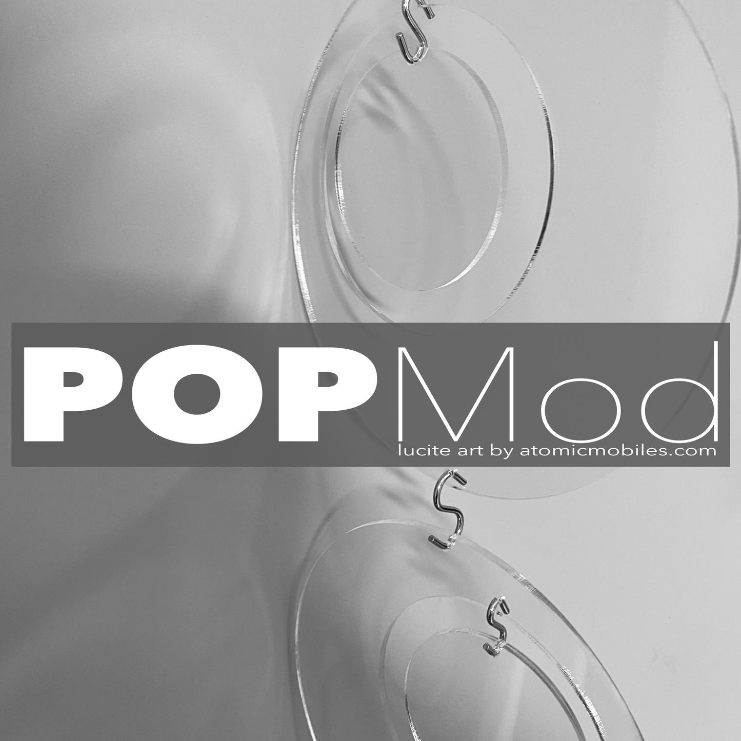 POPMod Groovy Clear Plexiglass Lucite Acrylic hanging art mobiles, room dividers, and curtains by AtomicMobiles.com