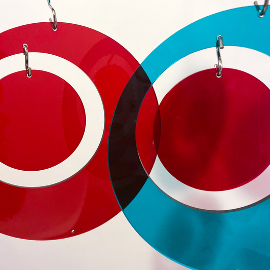 Clear acrylic plexiglass in Red and Teal Blue - closeup of AtomicMobiles.com Room Dividers parts