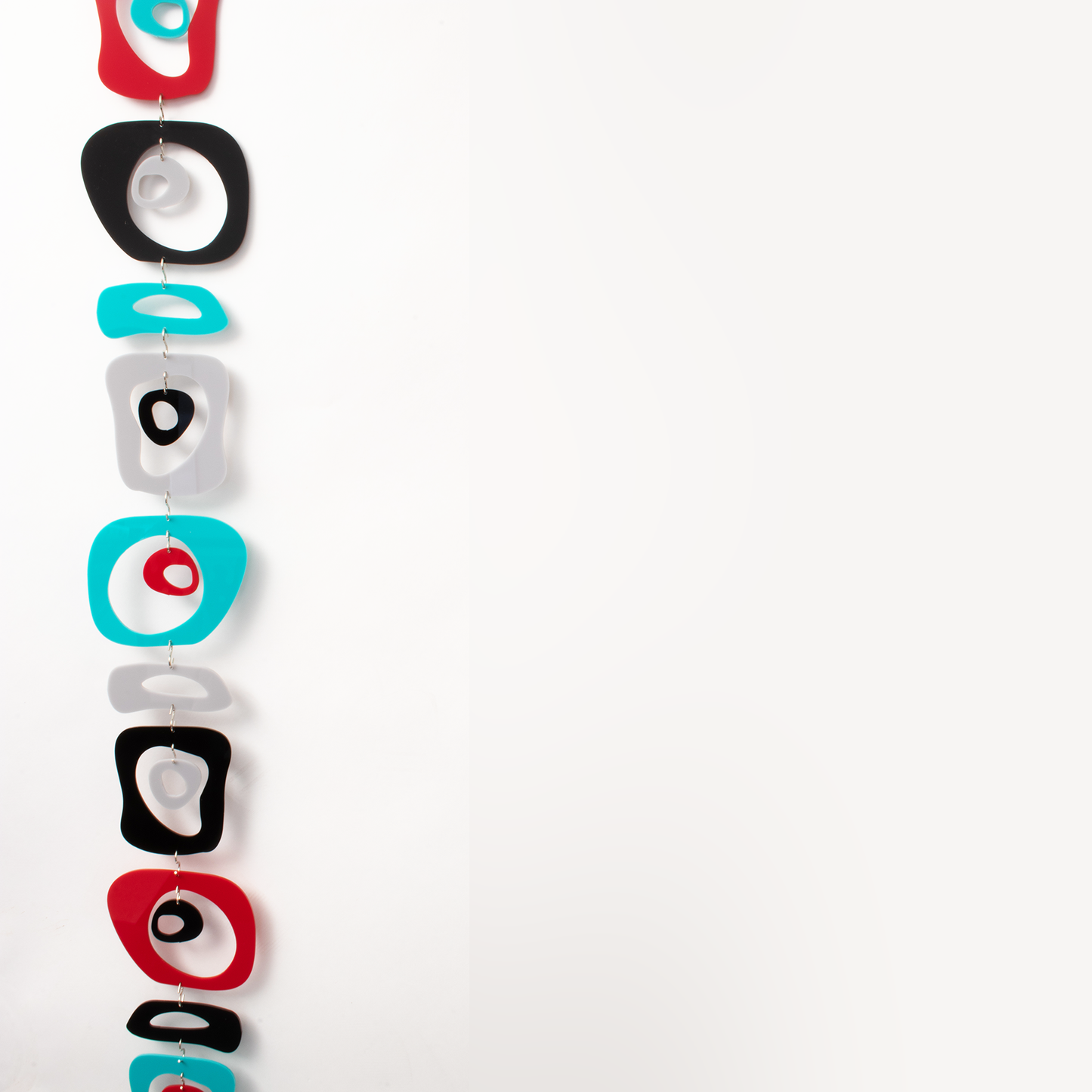 Retro-A-GoGo Screen Kit configured as a mobile in Retro Colors of Red Black Aqua and Gray by AtomicMobiles.com - room divider kits