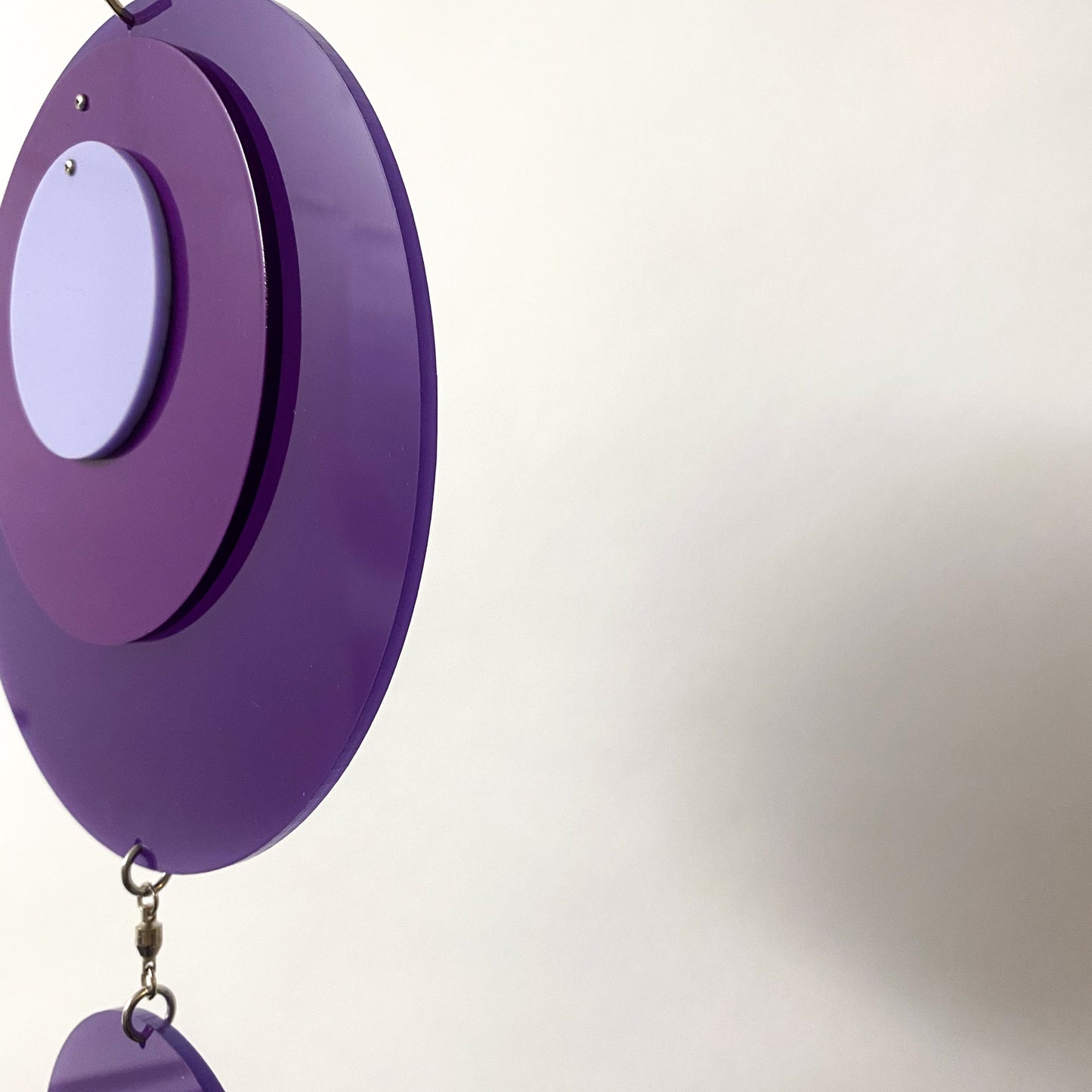 Side view closeup of Retro 1970s vertical kinetic art mobile in purple circle DOTS ready to ship today by AtomicMobiles.com