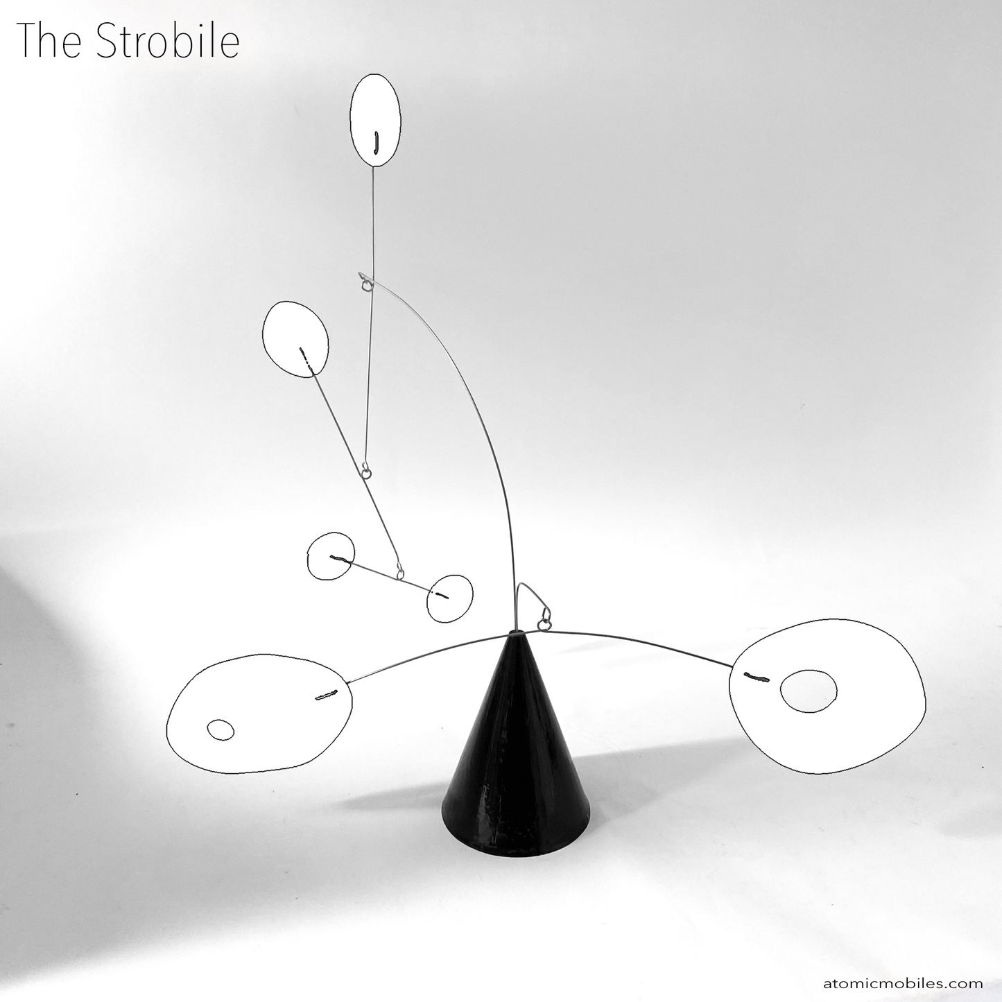 The Strobile table top kinetic art sculpture in black and white by AtomicMobiles.com