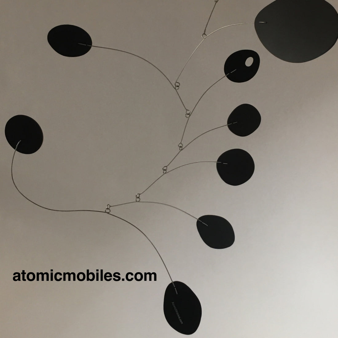 All black MCM hanging art mobile by AtomicMobiles.com
