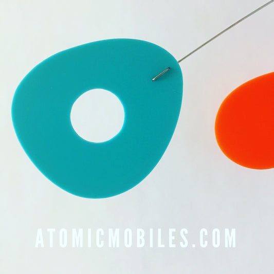 Aqua and orange closeup of ModCast hanging art mobile by AtomicMobiles.com