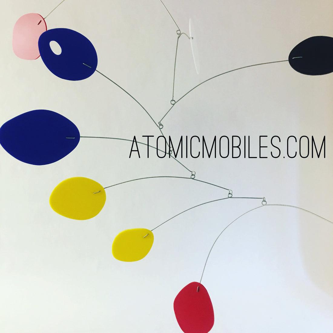 Blue yellow and red large hanging art mobile for client in NC by AtomicMobiles.com
