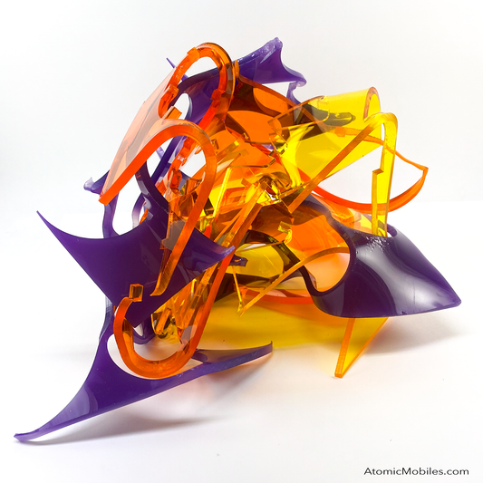 One of a kind Stellar abstract art sculpture in bold clear orange, clear yellow, and opaque purple - made from recycled/upcycled acrylic plexiglass by Debra Ann in Los Angeles of AtomicMobiles.com