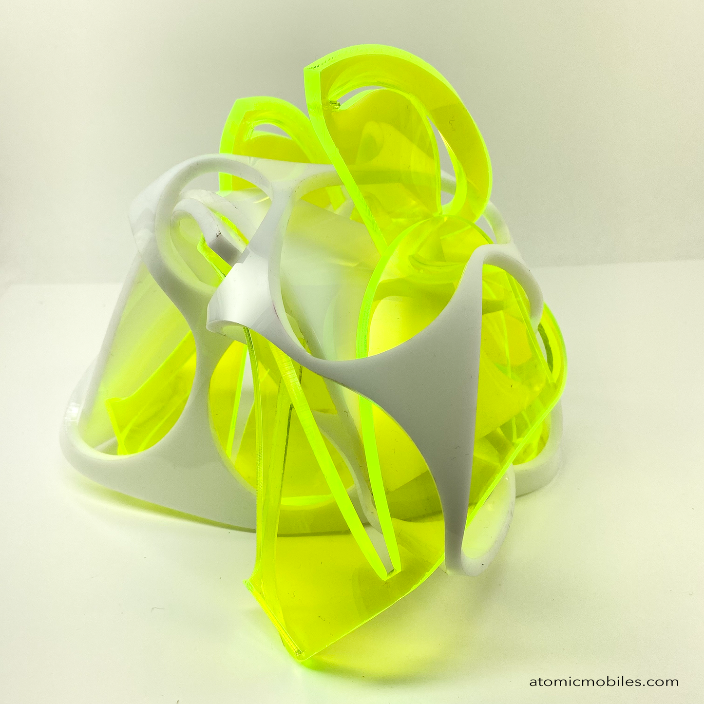 Thrill abstract art sculpture in neon fluorescent green and opaque white acrylic plexiglass - upcycled and recycled acrylic one-of-a-kind modern art by Debra Ann of AtomicMobiles.com in Los Angeles