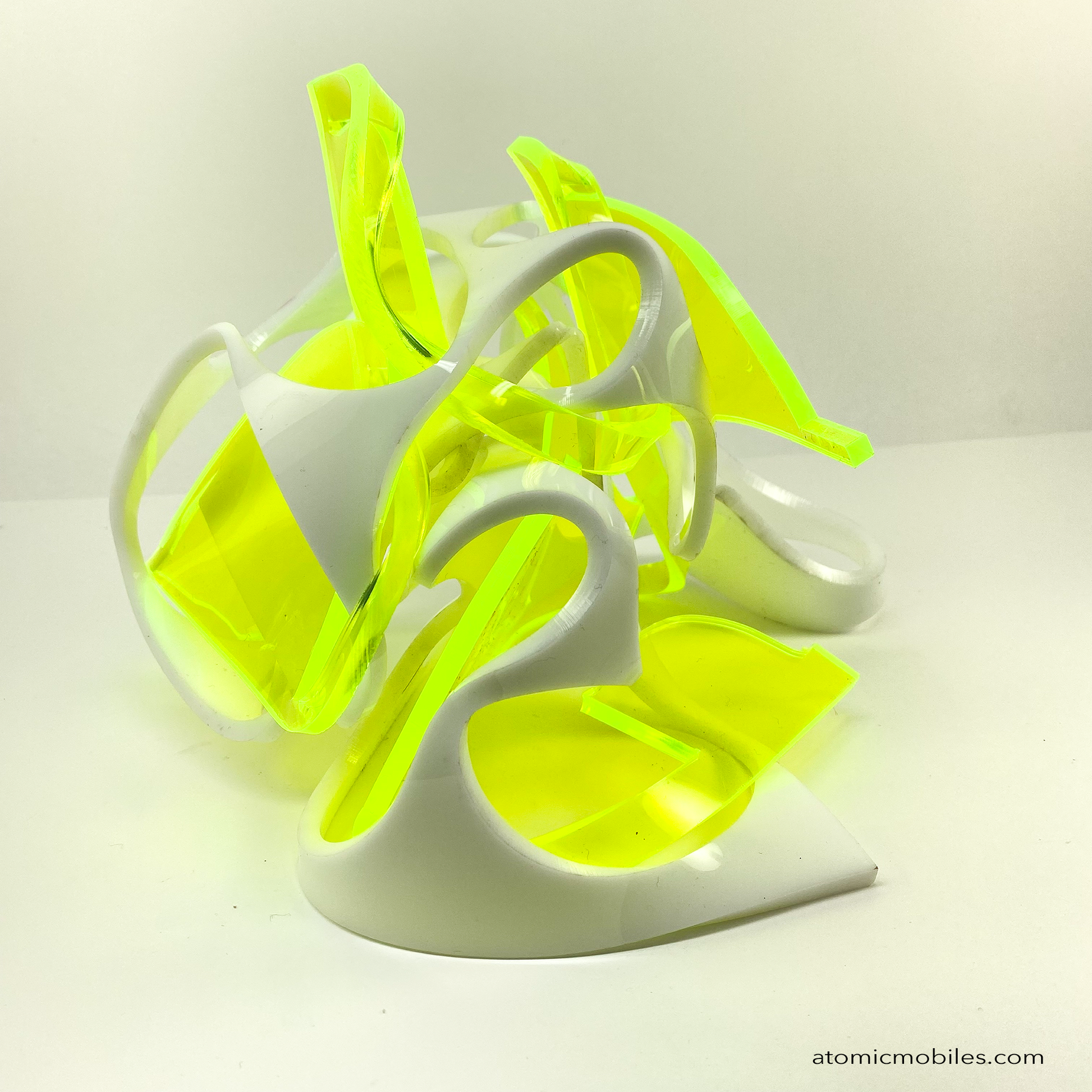 Another view of Thrill abstract art sculpture in neon fluorescent green and opaque white acrylic plexiglass - upcycled and recycled acrylic one-of-a-kind modern art by Debra Ann of AtomicMobiles.com in Los Angeles